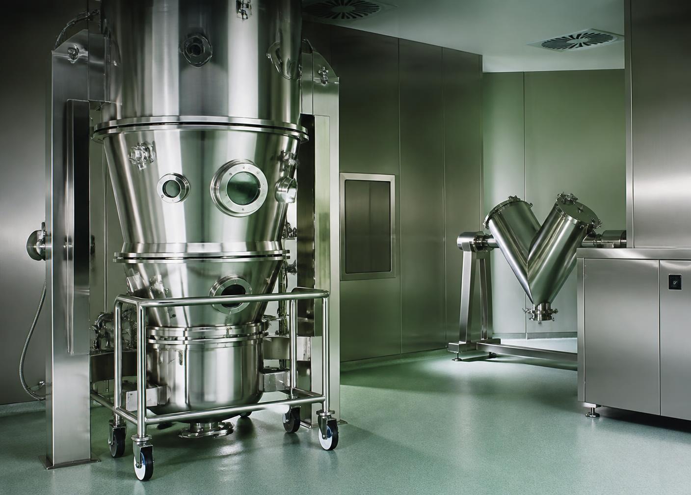 Stainless steel pharmaceutical production equipment in a clean manufacturing suite
